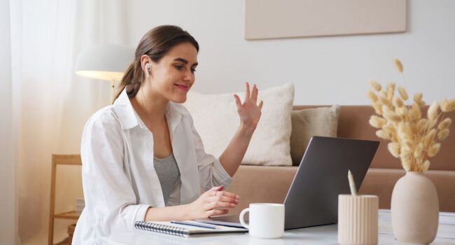 woman-waving-at-screen woman-waving-at-screen